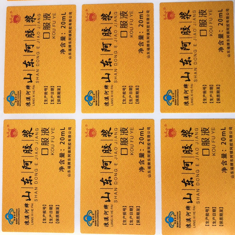 Stack of printed bottled-water labels in blue and white